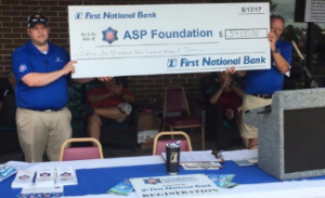 image of a giant check of the proceeds from the ASP Foundation Golf Tournament.